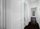 Bright hallway features white doors, dark wood floors, and natural light streaming in at 3100 11Th N Ave, St Petersburg, FL 33713