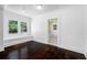 Bright living room featuring hardwood floors, white walls and trim, and large windows at 3100 11Th N Ave, St Petersburg, FL 33713