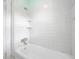 Clean, well-maintained white tile shower with built-in shelves, ready for relaxation at 3100 11Th N Ave, St Petersburg, FL 33713