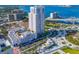 Beautiful aerial view of a modern high rise near a waterway, showing the surrounding cityscape and amenities at 331 Cleveland St # 1202, Clearwater, FL 33755