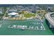 Aerial view showcasing a vibrant waterfront community with a marina, park, and city skyline at 331 Cleveland St # 1202, Clearwater, FL 33755
