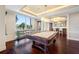 Billiard room with pool table, bar-height seating, and floor-to-ceiling windows at 331 Cleveland St # 1202, Clearwater, FL 33755