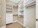 Walk-in closet with ample shelving and drawer space provides organized storage solutions at 331 Cleveland St # 1202, Clearwater, FL 33755