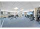 Well-equipped fitness center with weights, machines, and large windows offering views at 331 Cleveland St # 1202, Clearwater, FL 33755