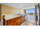 Bright kitchen offers white countertops, wood cabinets, and stainless steel appliances at 331 Cleveland St # 1202, Clearwater, FL 33755