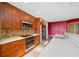 Well-equipped kitchen features stainless steel appliances, and mosaic backsplash at 331 Cleveland St # 1202, Clearwater, FL 33755