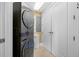 Convenient laundry area with a stackable washer/dryer and additional storage space at 331 Cleveland St # 1202, Clearwater, FL 33755