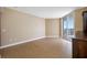 Open-concept living area with wood floors and sliding doors to the balcony, great natural light at 331 Cleveland St # 1202, Clearwater, FL 33755