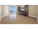 Bright living room with wood floors and sliding doors to the balcony with ocean views at 331 Cleveland St # 1202, Clearwater, FL 33755