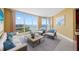Cozy living room with large windows offering scenic waterfront views at 331 Cleveland St # 1202, Clearwater, FL 33755