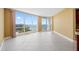Unfurnished living room with large windows and scenic waterfront views at 331 Cleveland St # 1202, Clearwater, FL 33755
