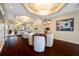 Lounge space with modern seating, dining area, and sleek dark-wood flooring at 331 Cleveland St # 1202, Clearwater, FL 33755