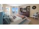 Comfortable primary bedroom with water views and decorative furnishings at 331 Cleveland St # 1202, Clearwater, FL 33755