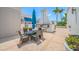 Inviting outdoor patio with a dining set and a built-in grill area, ideal for entertaining and enjoying al fresco meals at 331 Cleveland St # 1202, Clearwater, FL 33755