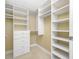 Organized walk-in closet featuring adjustable shelves and drawers for storage at 331 Cleveland St # 1202, Clearwater, FL 33755