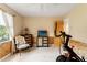 Cozy bedroom featuring workout equipment, neutral walls, and wood-look accents at 3320 Pattie Pl, Palm Harbor, FL 34685