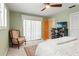 Inviting bedroom with a ceiling fan, carpeted floors, and a dresser with a television on top at 3320 Pattie Pl, Palm Harbor, FL 34685