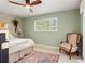 Comfortable bedroom with a ceiling fan, light-colored walls, and a window for natural light at 3320 Pattie Pl, Palm Harbor, FL 34685