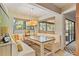 Charming breakfast nook with built-in seating, and views of the outside through multiple windows at 3320 Pattie Pl, Palm Harbor, FL 34685