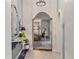 Hallway view showcases decor, lighting, and access to adjacent living space at 3320 Pattie Pl, Palm Harbor, FL 34685