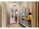 Elegant hallway with decorative mirror, lighting, and unique architectural details at 3320 Pattie Pl, Palm Harbor, FL 34685