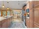 Modern kitchen with stainless steel appliances, granite countertops, and breakfast nook seating at 3320 Pattie Pl, Palm Harbor, FL 34685