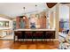 Open kitchen with a breakfast bar, stainless steel appliances, and pendant lighting, perfect for entertaining at 3320 Pattie Pl, Palm Harbor, FL 34685