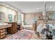 Luxurious bathroom featuring double vanities, a soaking tub, and a separate shower at 3320 Pattie Pl, Palm Harbor, FL 34685