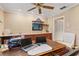 Well-lit home office features custom built-ins, warm lighting, and a large wooden desk at 3320 Pattie Pl, Palm Harbor, FL 34685