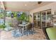 Charming patio features a seating area with a table and chairs, with a view of the backyard at 3320 Pattie Pl, Palm Harbor, FL 34685