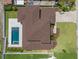Overhead shot reveals a beautifully landscaped home with a private pool, patio area, and well-maintained lawn at 4166 38Th S St, St Petersburg, FL 33711