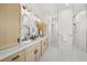 Bright bathroom featuring double sinks, double showers, and modern fixtures at 4166 38Th S St, St Petersburg, FL 33711