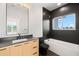 This bathroom features a black backsplash, a vanity, and a soaking tub at 4166 38Th S St, St Petersburg, FL 33711