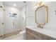 Stylish bathroom features glass-enclosed shower, attractive vanity, and modern fixtures at 4166 38Th S St, St Petersburg, FL 33711