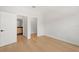 This bedroom features a wood floor and entryways to the bathroom and closet at 4166 38Th S St, St Petersburg, FL 33711