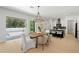 Bright dining area featuring sliding doors and an adjacent modern kitchen at 4166 38Th S St, St Petersburg, FL 33711