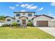 Stunning two-story home with a manicured lawn and a modern three-car garage at 4166 38Th S St, St Petersburg, FL 33711
