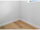 Empty room featuring light wood floors, white walls, and white trim at 4166 38Th S St, St Petersburg, FL 33711
