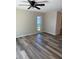 Bedroom with luxury vinyl plank flooring and a bright window at 4212 Pasadena Cir, Sarasota, FL 34233