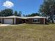 Charming single-story home with a well-manicured lawn and an attached two-car garage at 4212 Pasadena Cir, Sarasota, FL 34233