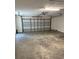 Spacious two-car garage with concrete flooring and an automatic door opener at 4212 Pasadena Cir, Sarasota, FL 34233