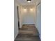 Hallway featuring luxury vinyl plank flooring, closet, and neutral paint at 4212 Pasadena Cir, Sarasota, FL 34233