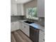 Bright kitchen featuring granite countertops, stainless steel appliances, and modern cabinetry at 4212 Pasadena Cir, Sarasota, FL 34233