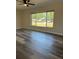 Bright living room with large windows and luxury vinyl plank flooring at 4212 Pasadena Cir, Sarasota, FL 34233