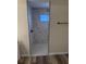 Modern shower featuring marble tile, river rock floor, and a sleek black shower head at 4212 Pasadena Cir, Sarasota, FL 34233