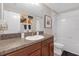 Well-lit bathroom featuring modern fixtures, a granite countertop, and a tub-shower combo for everyday convenience at 4639 Bexley Village Dr, Land O Lakes, FL 34638