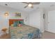 Comfortable bedroom featuring natural lighting, a ceiling fan, and closet space for an optimal living area at 4639 Bexley Village Dr, Land O Lakes, FL 34638