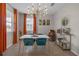 Inviting dining area with stylish decor, natural light, and a modern bar cart at 4639 Bexley Village Dr, Land O Lakes, FL 34638
