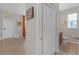 Inviting entryway features neutral walls, stylish decor, tile flooring, and convenient access to a half bathroom at 4639 Bexley Village Dr, Land O Lakes, FL 34638