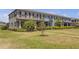 Charming townhome with manicured lawn, neatly trimmed shrubs, and pleasant curb appeal at 4639 Bexley Village Dr, Land O Lakes, FL 34638